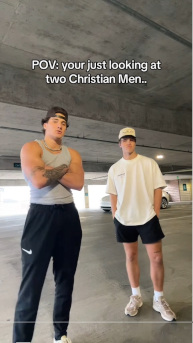 Snapshot of a TikTok that says "POV: your just looking at two Christian Men.." There are two young men, one has a backwards baseball cap and muscle shirt, mean mugging the camera with his arms crossed. The other has a baggy t-shirt, short shorts, crew socks, and regular baseball cap with his hands in his pockets.